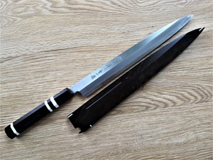 Show details for Akazawa Togashi Ao-ichi-Ko Hongasumi Yanagi 300mm Free upgrade Gokujyou Ebony Saya Cover ( Semi handmade )(Market price $138)+Ebony Triple White Ring Picture of Akazawa Togashi Ao-ichi-Ko Hongasumi Yanagi 300mm Free upgrade Gokujyou Ebony Saya Cover ( Semi handmade )(Market price $138)+Ebony Triple White Ring