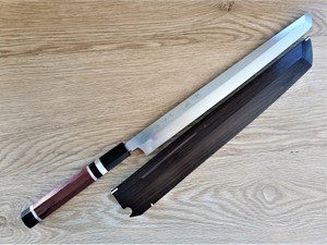 Show details for Akazawa Togashi Ao-Ko Honyaki Sakimuru Takobiki Free upgrade Gokujyou Ebony Saya Cover ( Semi handmade )(Market price $138)+red hard wood handle Picture of Akazawa Togashi Ao-Ko Honyaki Sakimuru Takobiki Free upgrade Gokujyou Ebony Saya Cover ( Semi handmade )(Market price $138)+red hard wood handle
